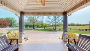 ...or invites you to sit and enjoy the peace and quiet while viewing a beautiful open field across the road.  Occasionally, horses, donkeys or cows roam the field for your pleasure.