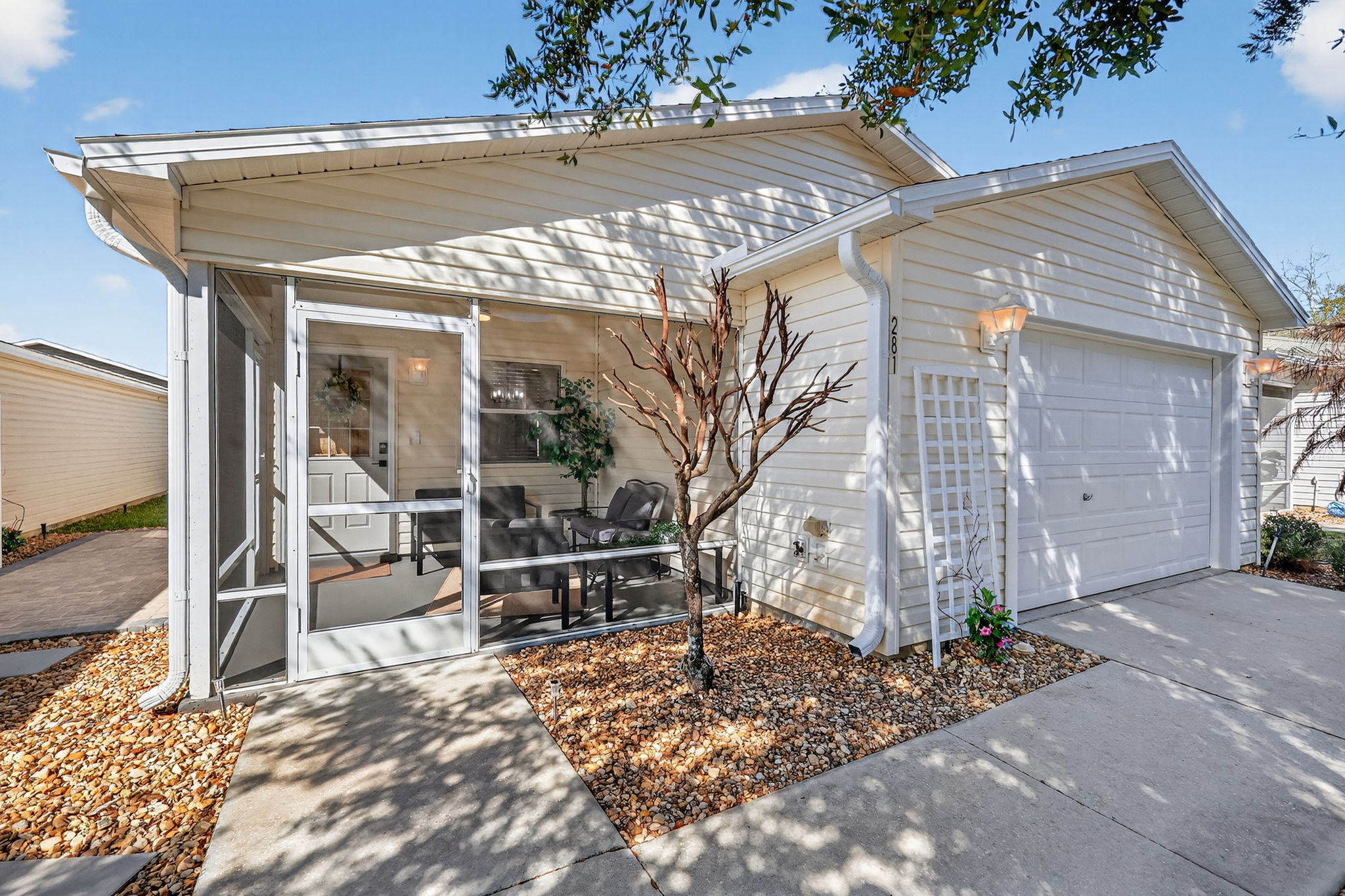 Front Elevation with Screened Lanai and Side Paver Patio