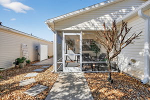 Front Elevation with Screened Lanai and Side Paver Patio
