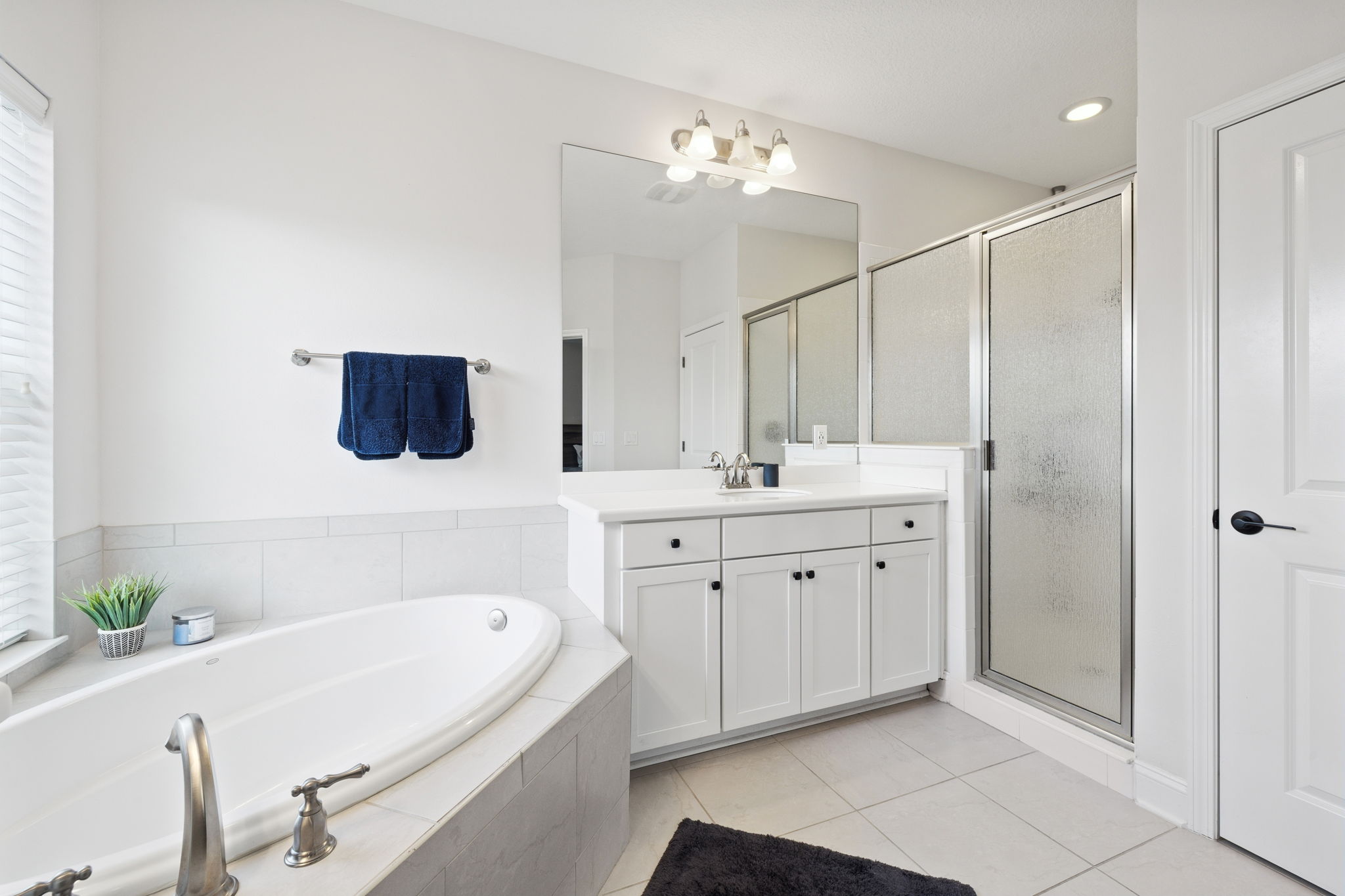 Owners Bath has Double Vanity, Garden Tub, Step in Shower