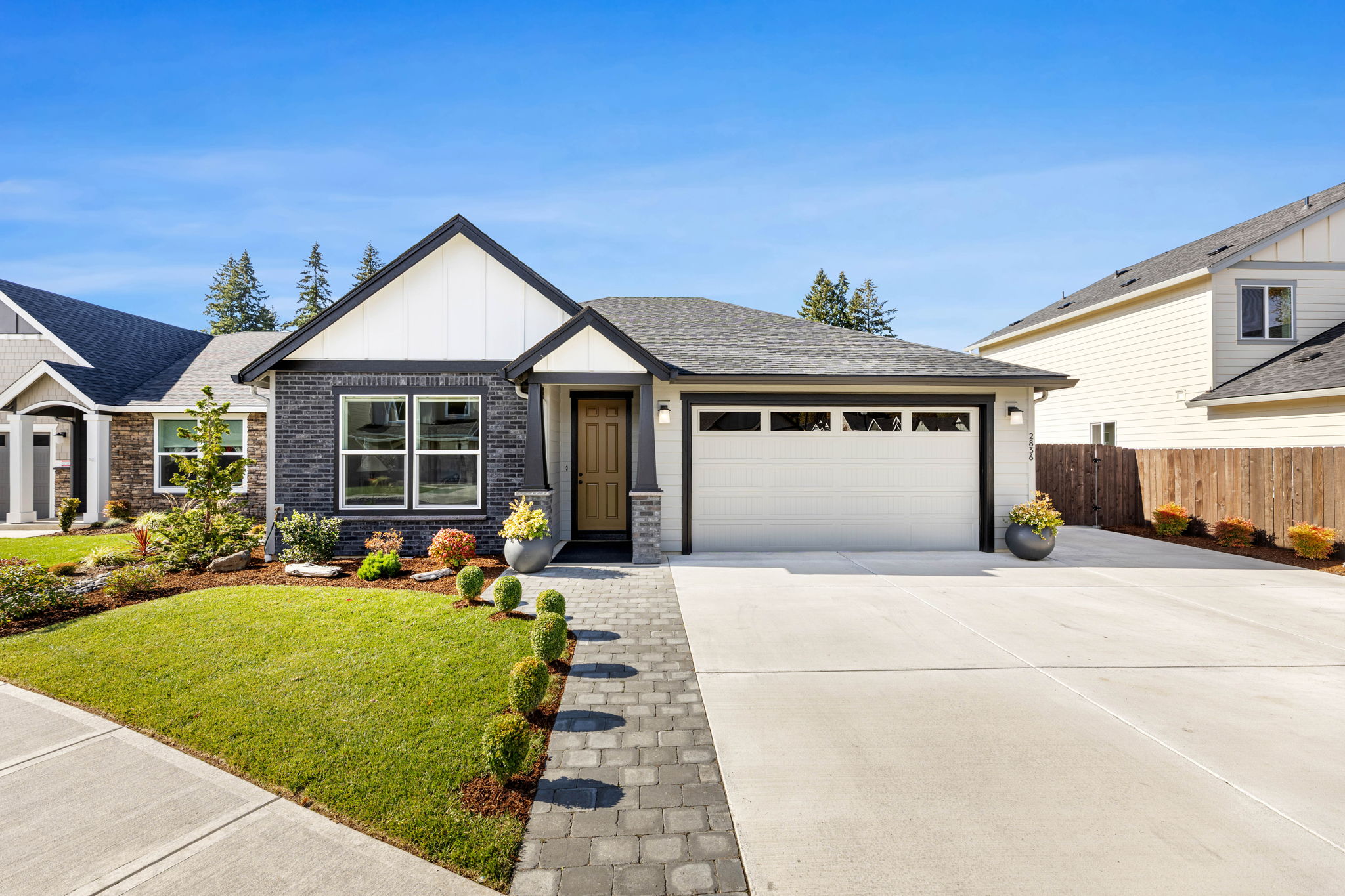 Front of 2836 NW 8th Ave, Battle Ground, with professional landscaping and paver walkway