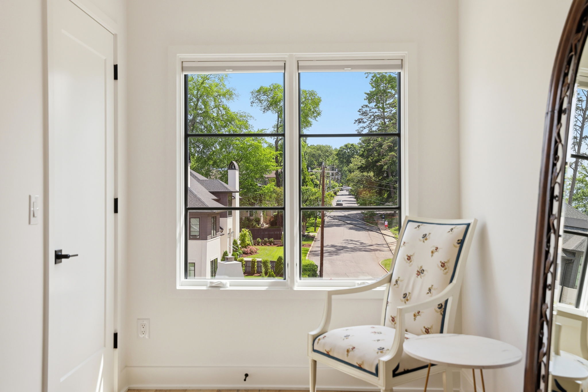 A peaceful bedroom retreat with a charming, tree-lined streetscape - the perfect spot to just chill and relax.
