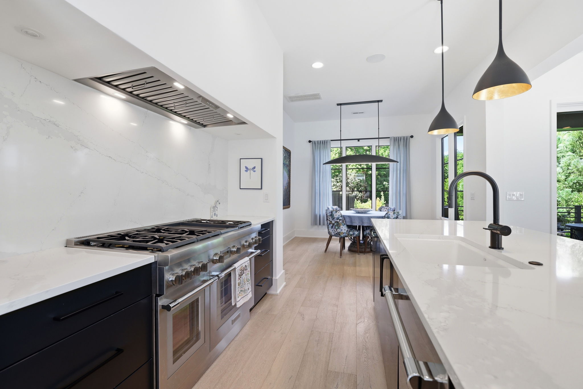 Designed for cooking & gathering featuring a 48" dual fuel range with a 6-burner gas cooktop and double oven