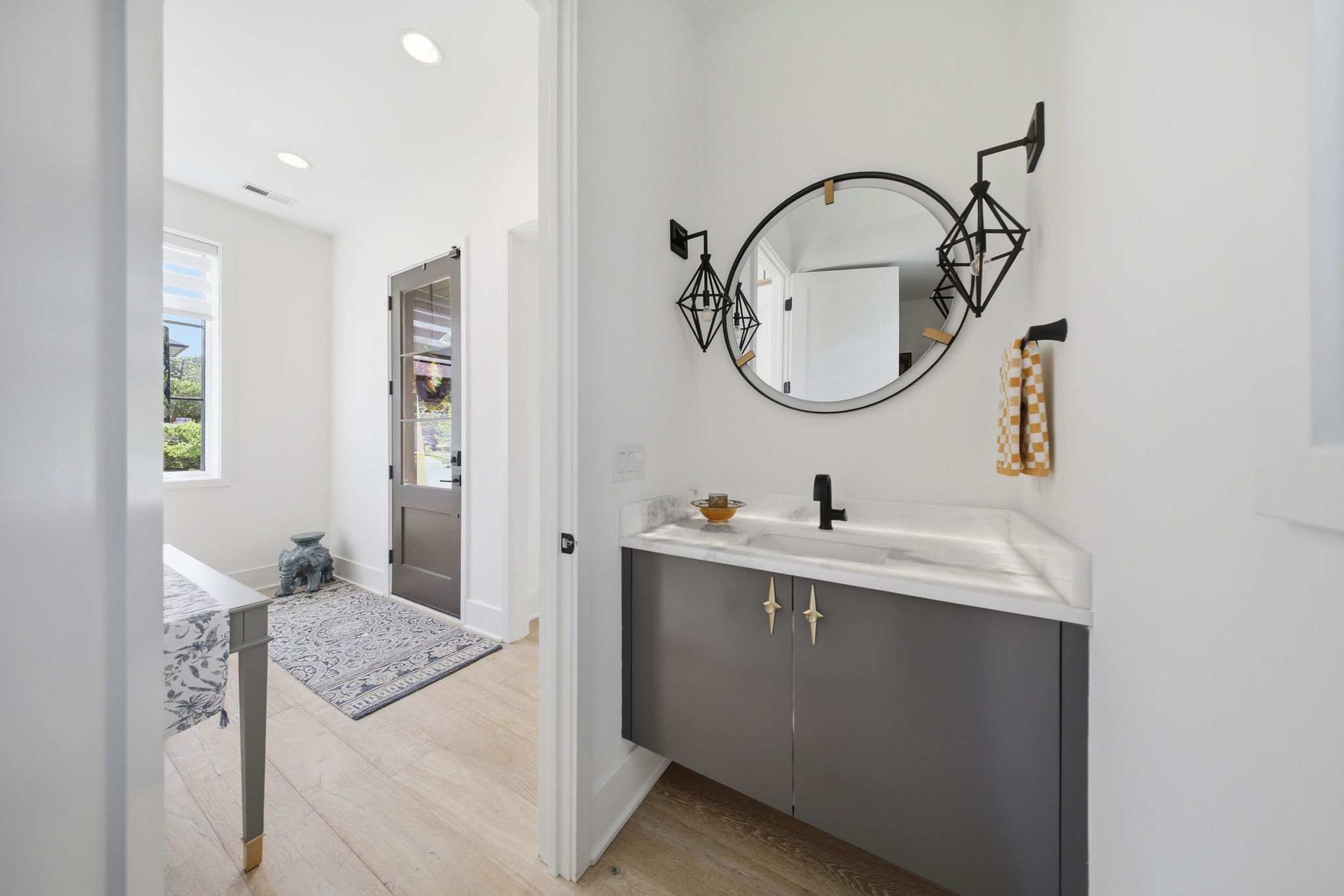 Striking Powder Room with Backlit Marble Countertop