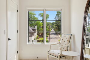 A peaceful bedroom retreat with a charming, tree-lined streetscape - the perfect spot to just chill and relax.