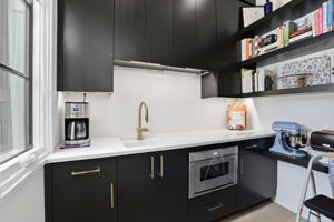 Well-Appointed Scullery with sink, microwave & ample storage