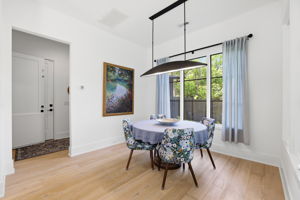 Dining room opens onto the entry from garage and the elevator foyer