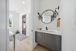 Striking Powder Room with Backlit Marble Countertop