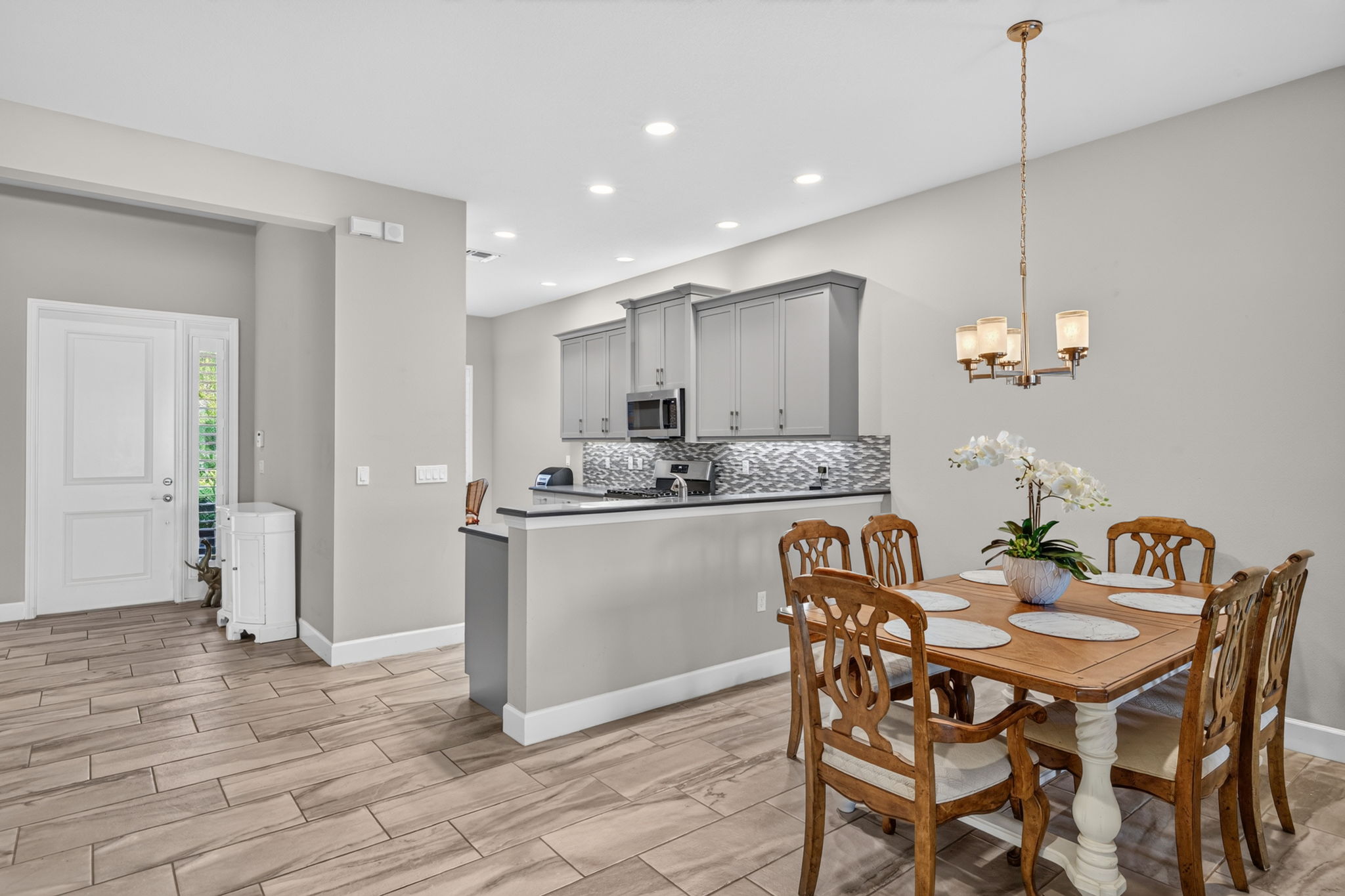There's also a breakfast nook in this Bristol villa! Kitchen features upgraded appliances (replaced garbage disp., dishwasher, and microwave in '25). Extra recessed lighting present in kitchen also.