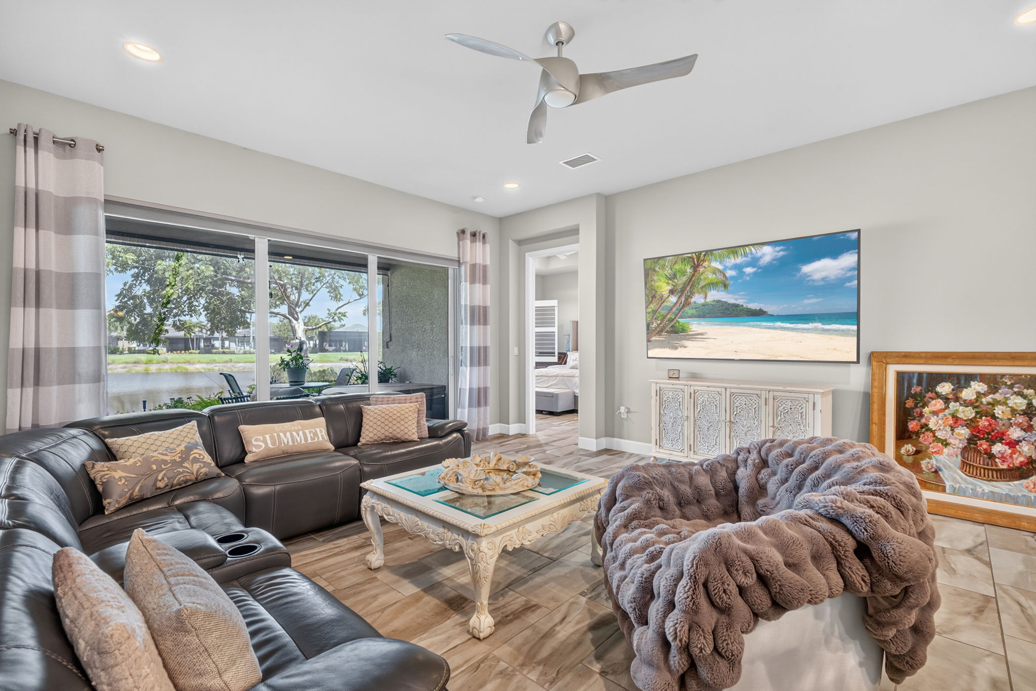 Spacious great room is adjacent to primary suite; all with high impact glass and doors!