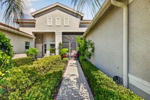 Screened front porch for extra outdoor living space! Widened walkway and driveway