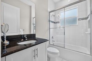 Comfort height toilet and sink, plus floor to ceiling tile in shower with listello accent tile border!