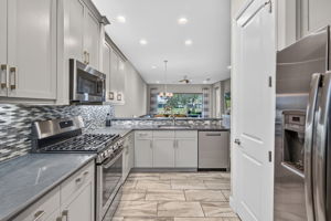 See the big pantry?? Gas stove and large single sink present, too.