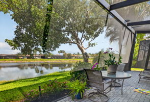 THIS EXPANDED LAKEFRONT PATIO IS SCREENED THE ENTIRE WIDTH OF THE VILLA! Ahh! Enjoy!