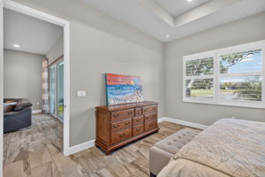 Tray ceiling, plenty of space for a king bed and triple dresser here!