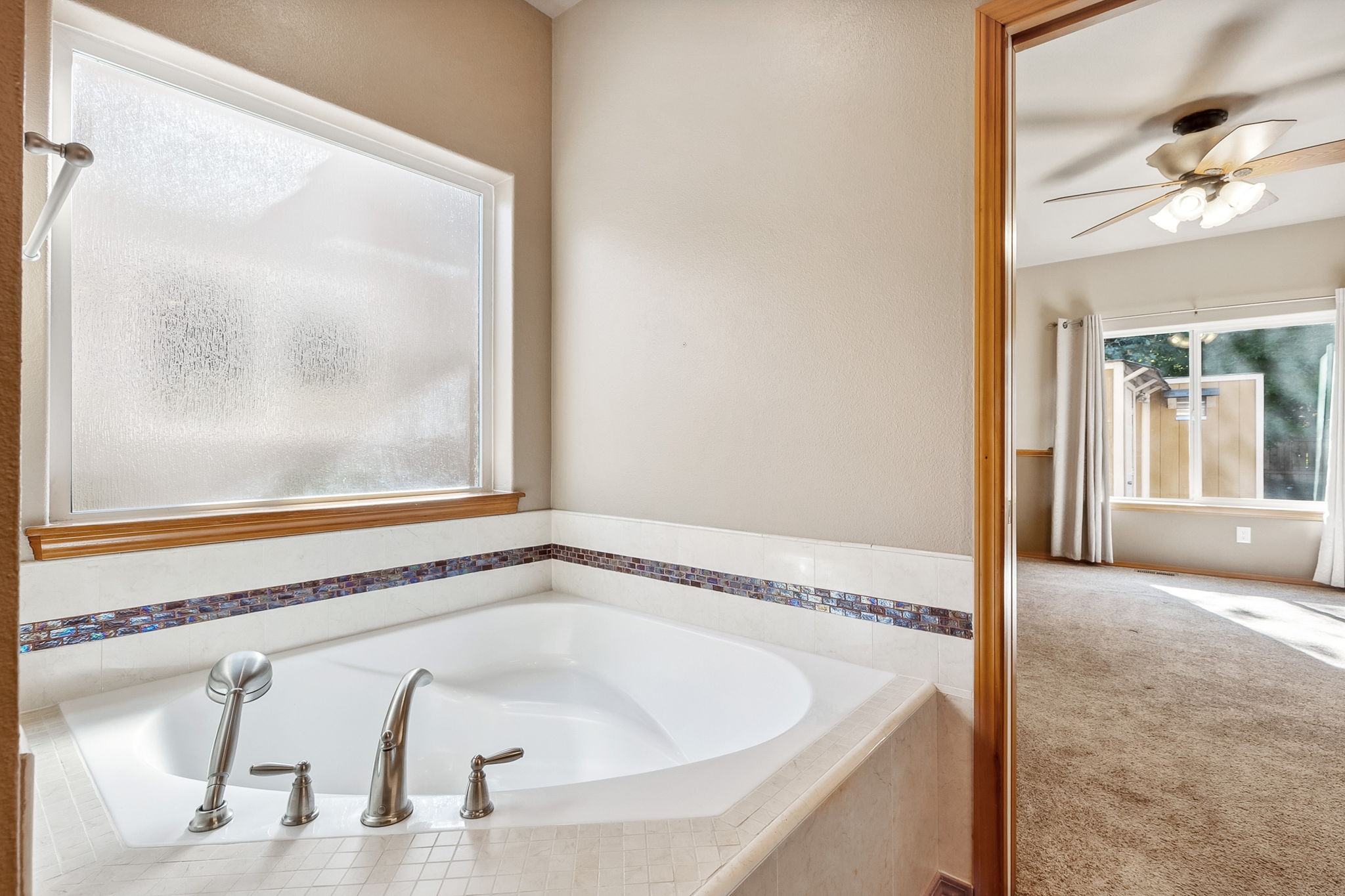 Large soaking tub is a sweet spot to relax.