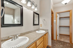 Double sink in your updated en suite bathroom that has heated floors!