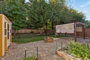 Patio space, and some grass too. The short black fence is the property line.