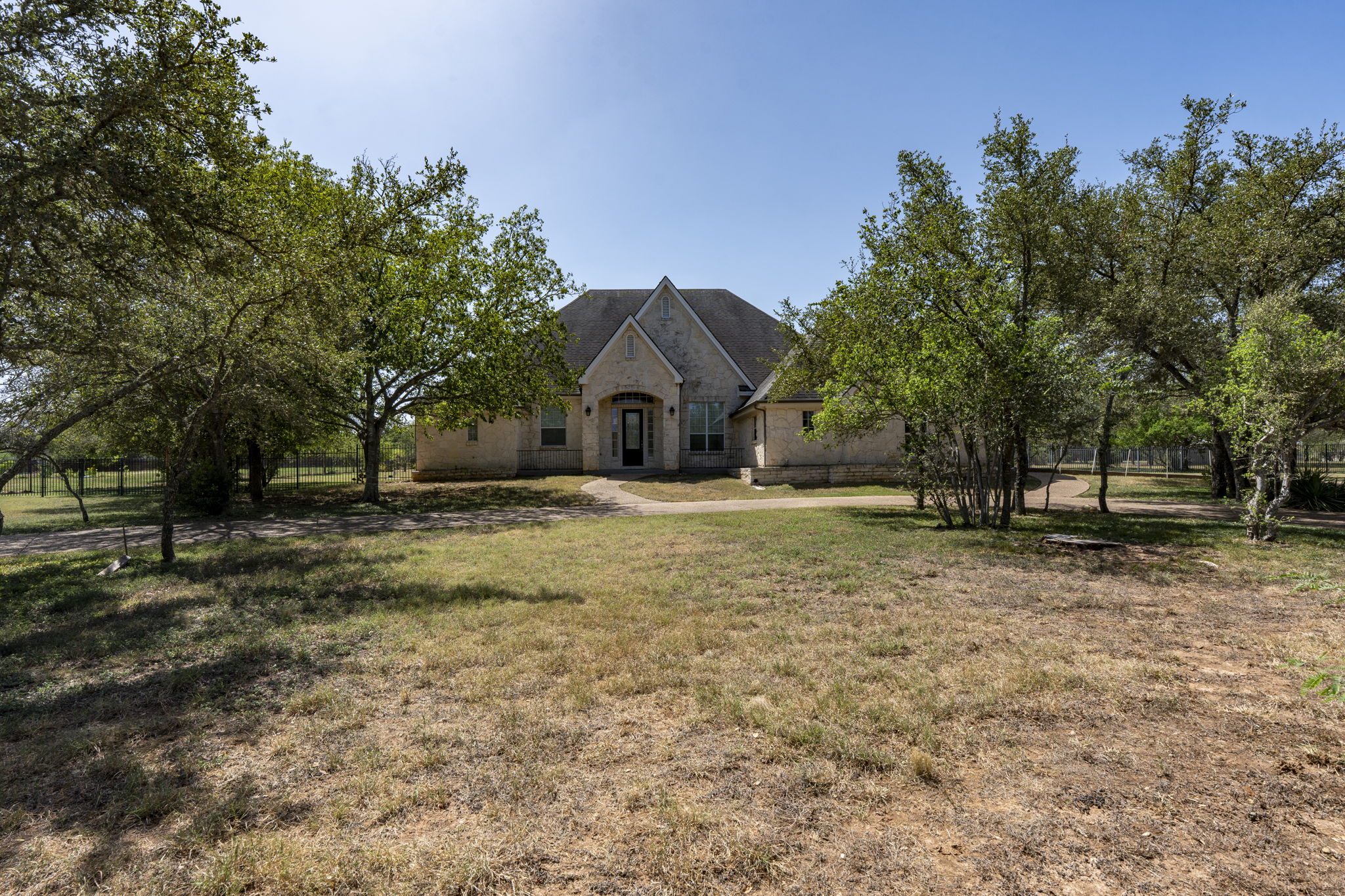 Beautiful home sits on 1.5 acres with a round about curved driveway.