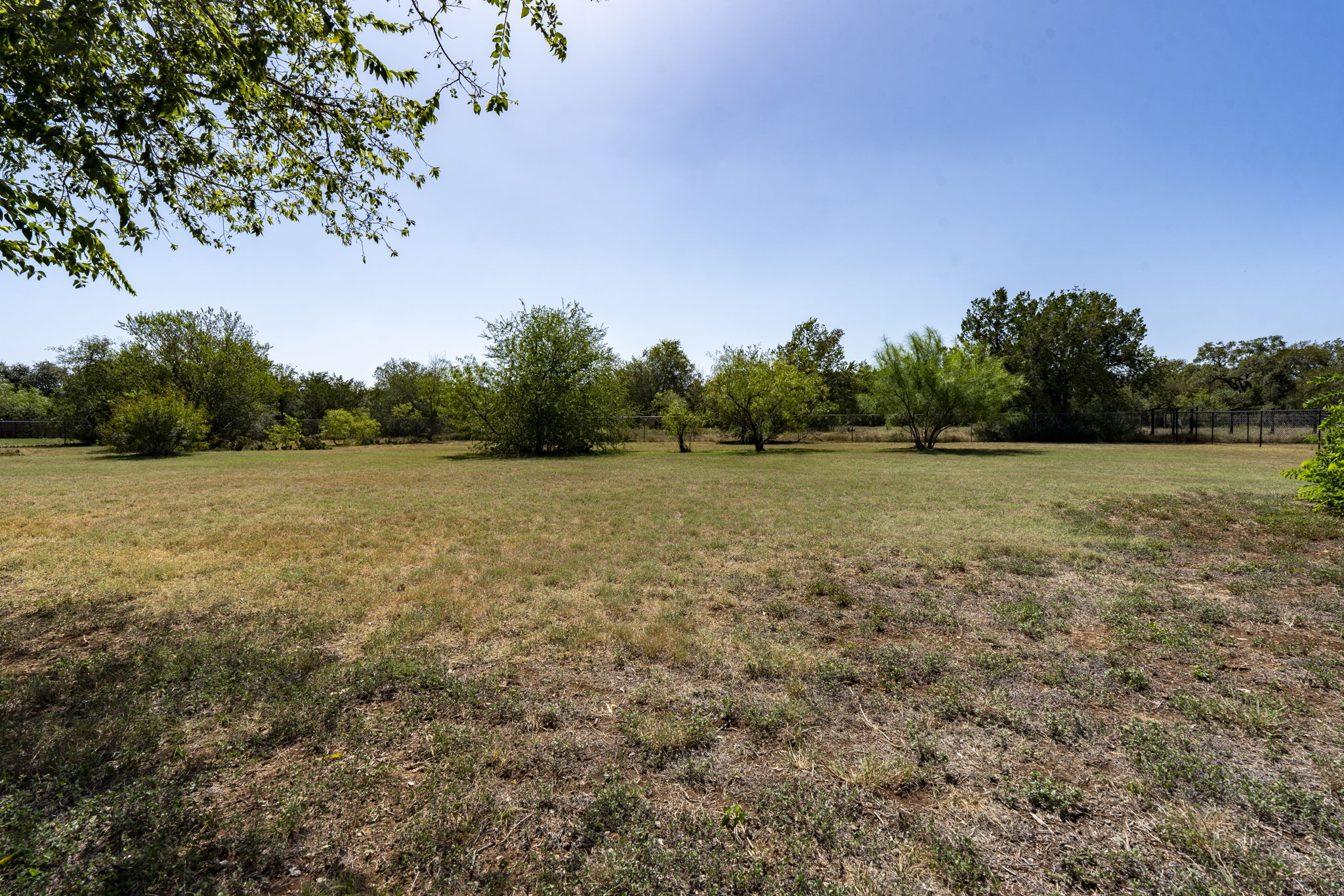 Property in the back yard is mostly flat and not wooded. Perfect for your pool oasis design.