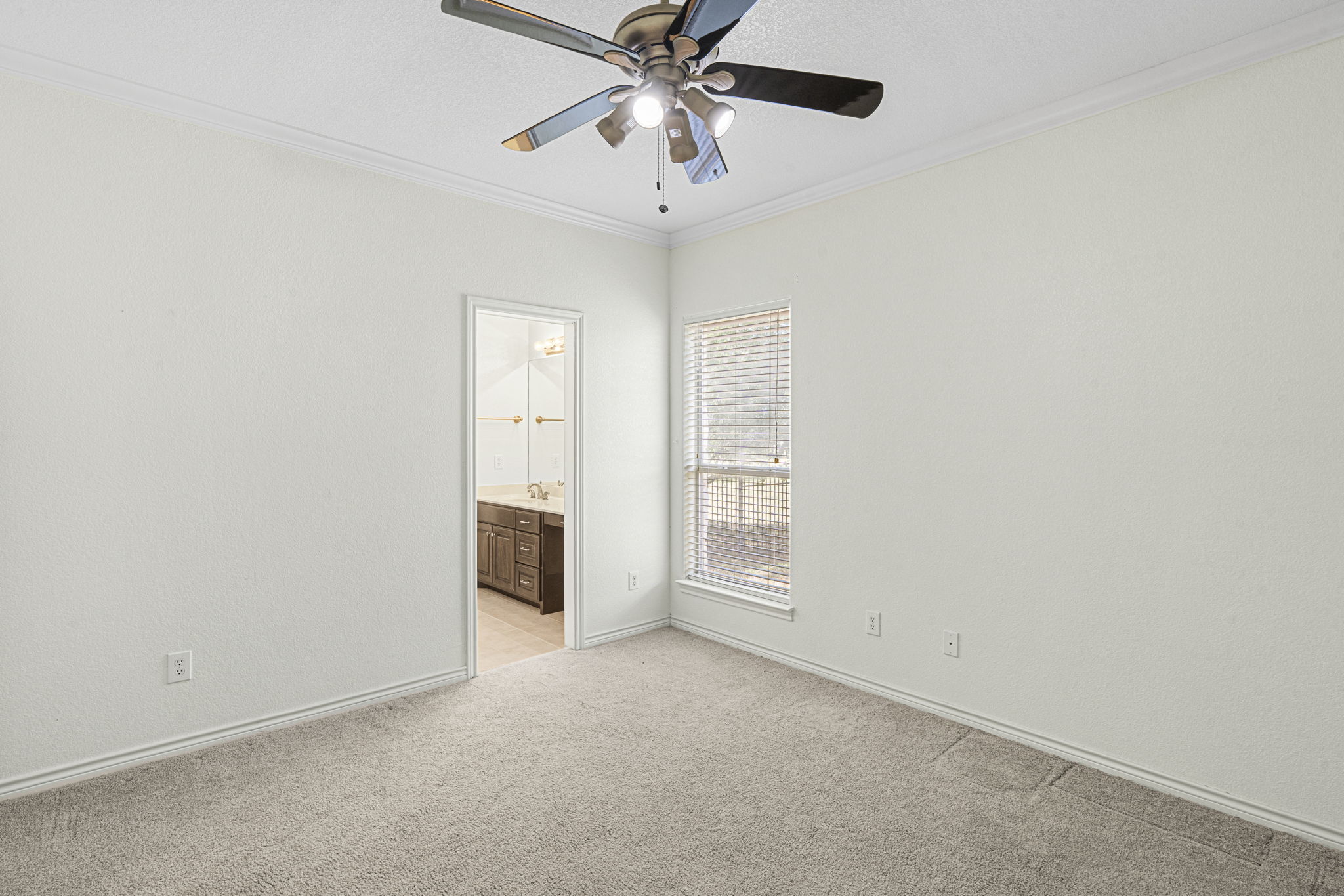 Middle secondary bedroom with Jack n Jill bathroom with each individual sink vanity.
