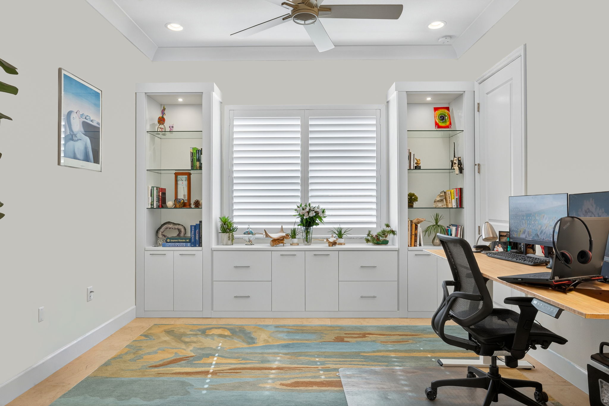 The den w/ built-ins and contemporary insided mounted doors, lockable drawers, and walk-in closet is currently used as a den.