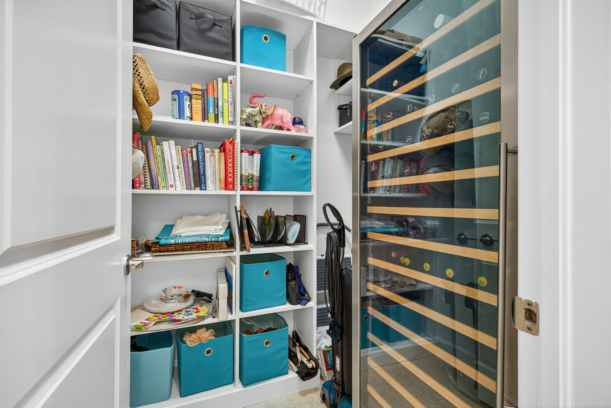 Here it is! Your dedicated storage room for Costco sized paper towels, and anything else your little heart desires! Wine cooler does not convey, but electricity present for charging your robot vacuums, etc.