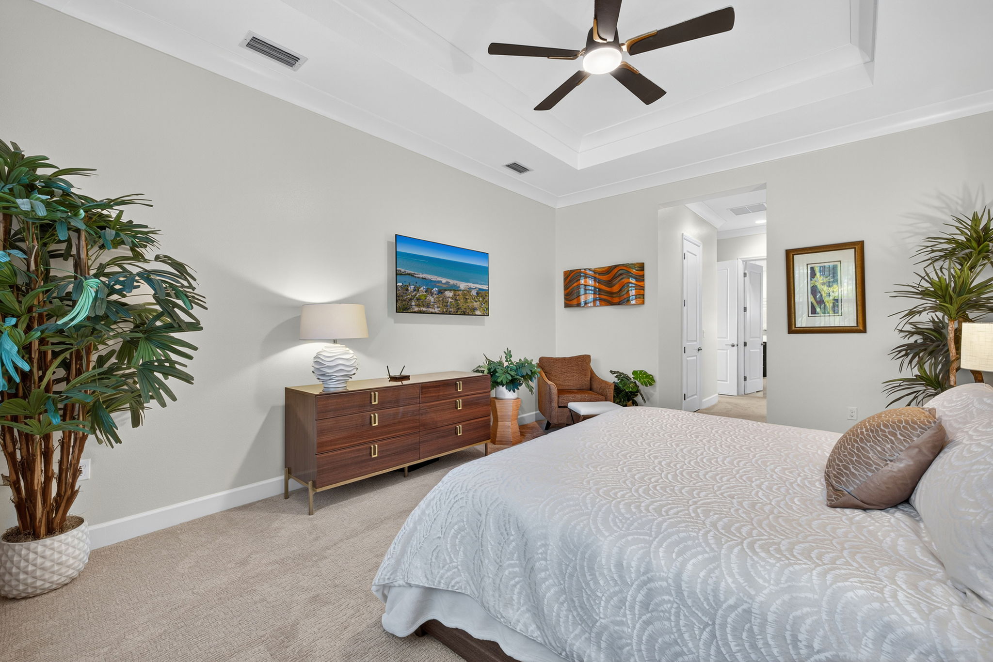 Spacious enough for a king bed, 2 night stands, a triple dresser and a chair! Note the tray ceiling and crown molding!