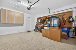 Epoxy fllor, exterior side 'man' door, hanging storage cabinets and wall mounted storage system will convey!