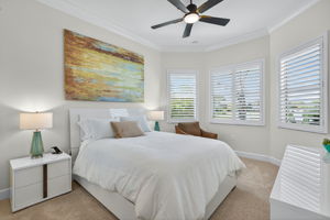 This bedroom is on the front of the home and has the unique feature of being more private as an extra guest suite with the addition of a door from the hallway to the 3rd full bath and this bedroom.