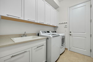 Updated LG washer/dryer. Dryer is electric, but gas hook-up still there if you wish to convert. Large utility sink and plenty of cabinets for storage, too!