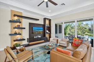 This custom accent wall is even more stunning in person...feel the artisan's handiwork in the Venetian plaster areas, soak in the lighted floating shelves to display your treasures, and appreciate the free floating shelf to hold your electronics.