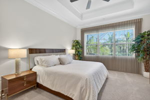 Custom blackout fabric shades and immediately post closing super upgraded carpeting and padding combined with waking up to a pool and lake view make this primary bedroom a dream come true!