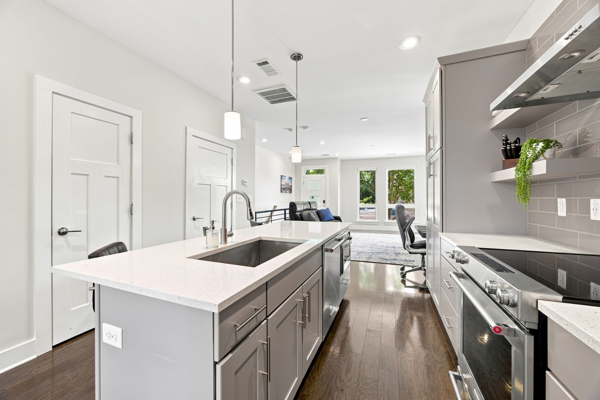 Oversized Island with Sink, Storage, and Additional Seating