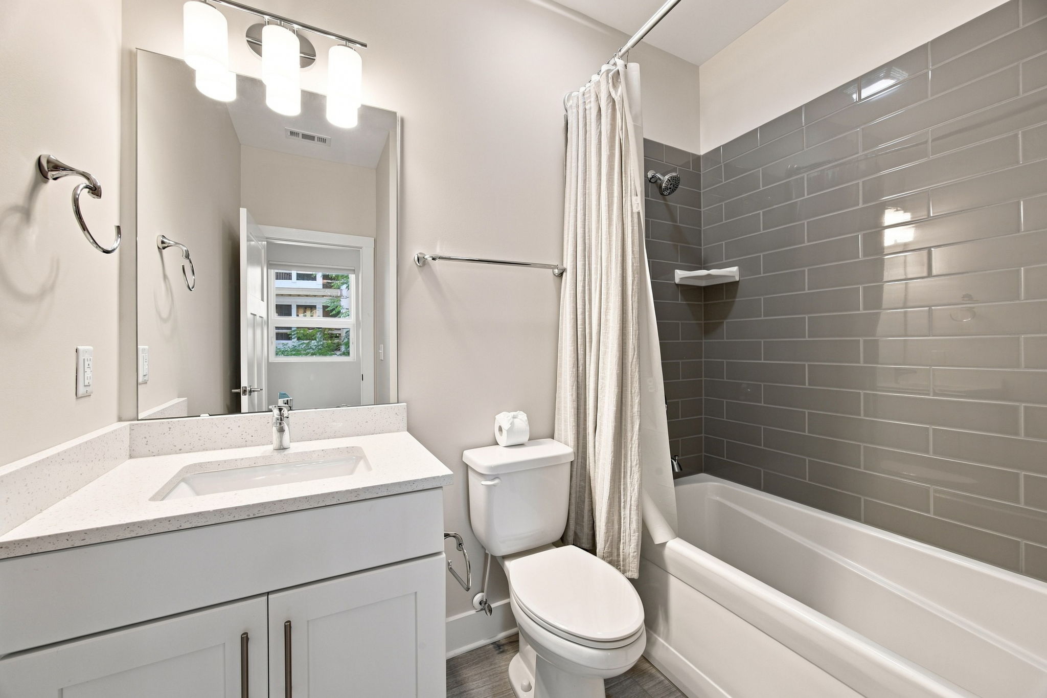 Second Full Bathroom with Tiled Tub and Shower Surround