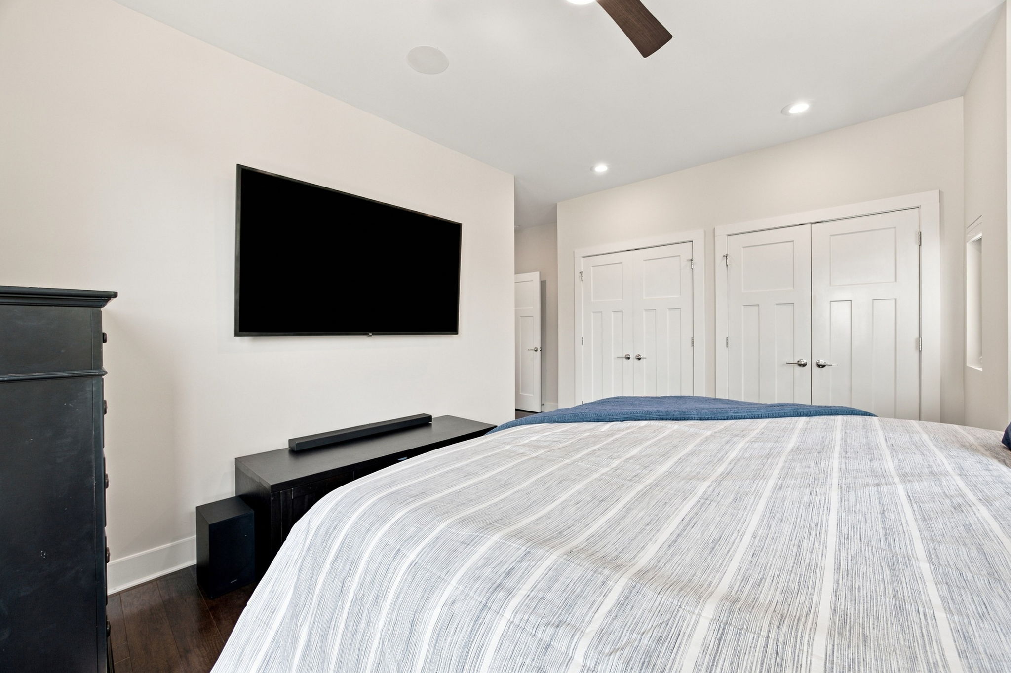Primary Suite with Wood Floors and Flexible Furniture Space