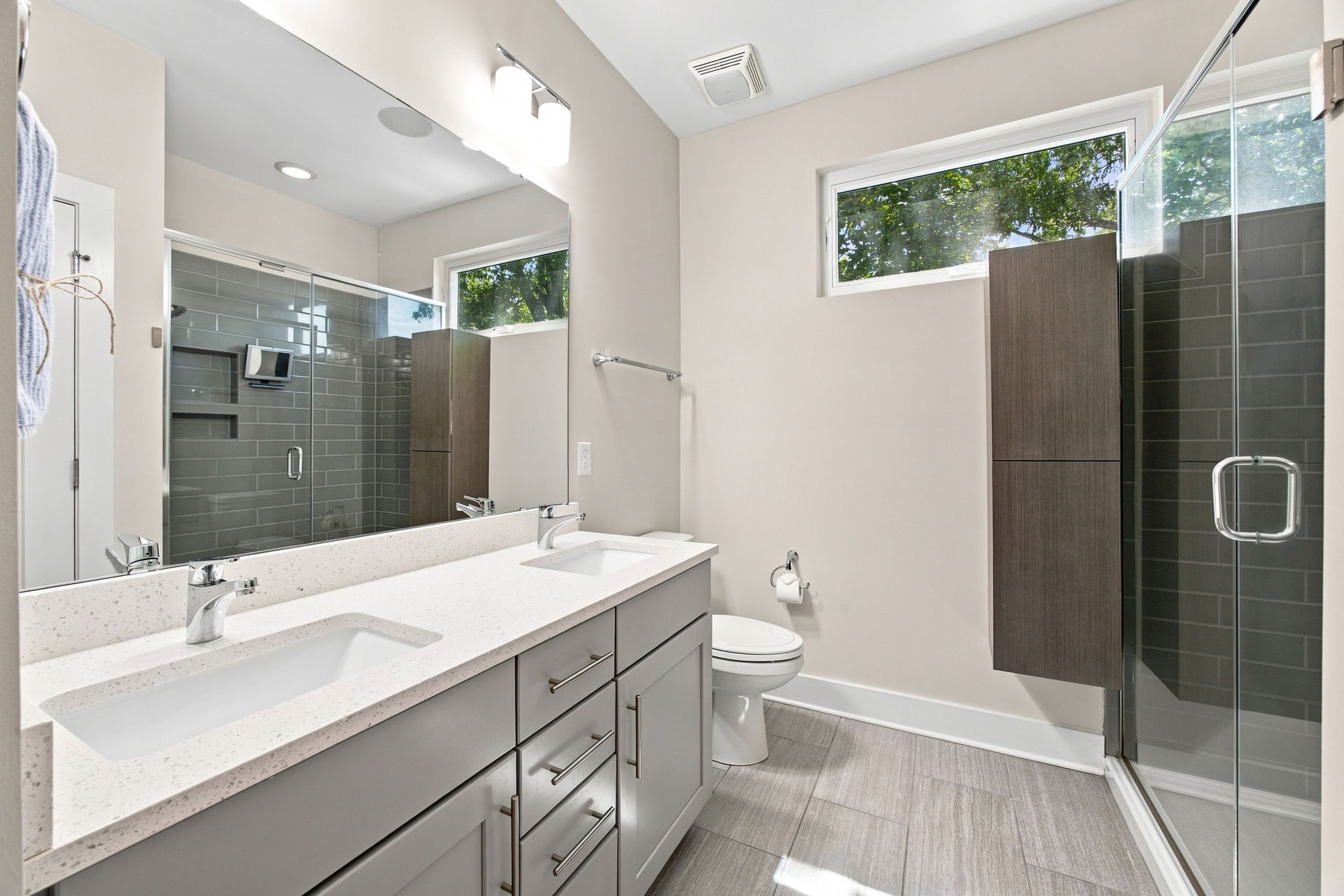 Primary Bathroom with Dual Vanity and Oversized Tiled Shower