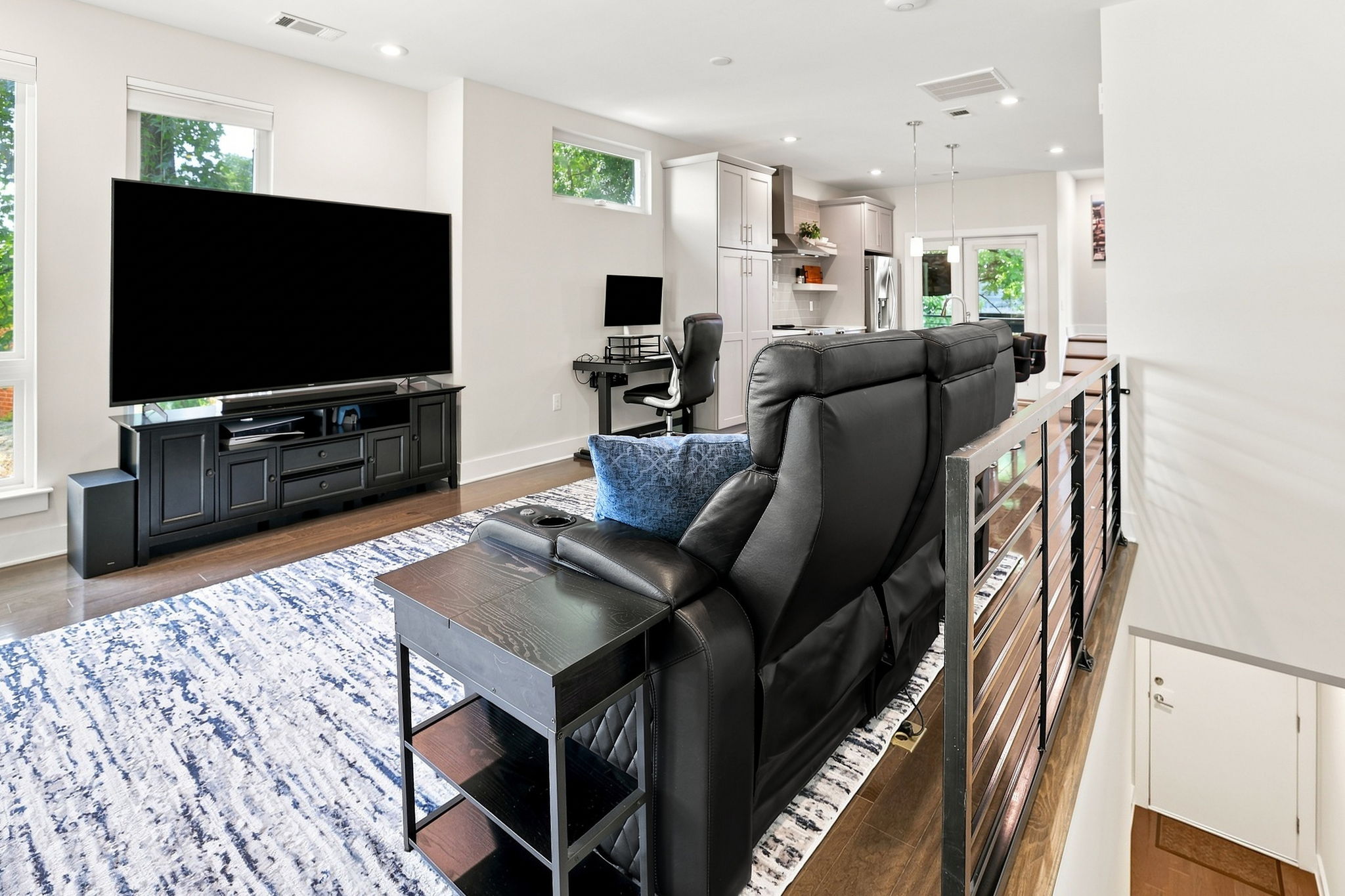 Open Living Area with Wood Floors and Recessed Lighting