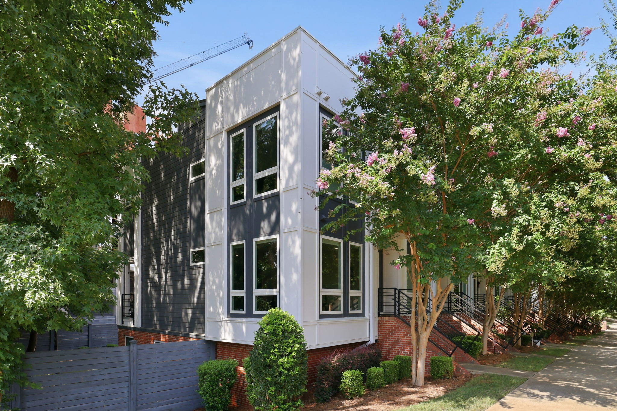 End-Unit Exterior Surrounded by Mature Trees