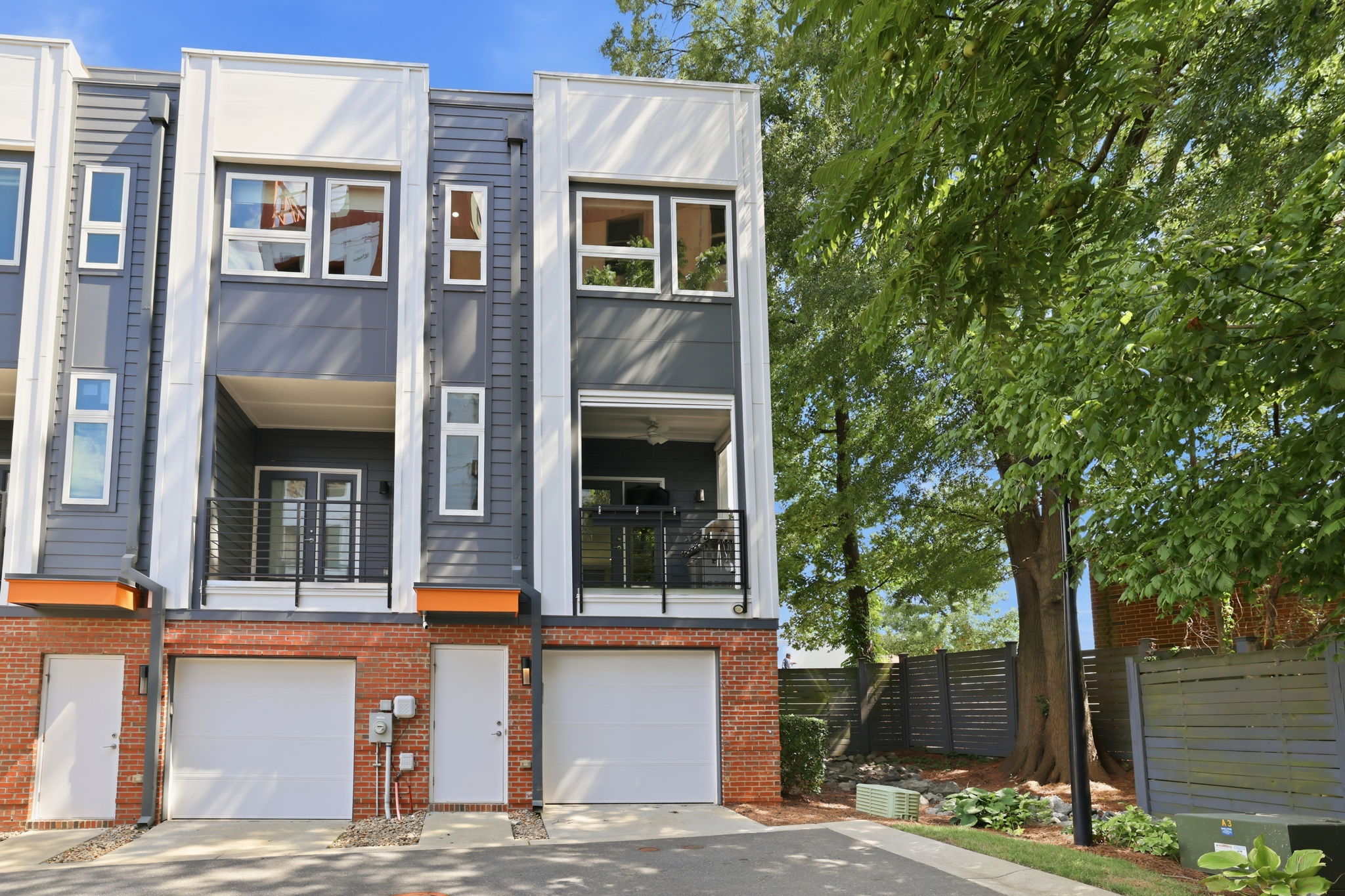 Rear Exterior with Attached Garage and Additional End-Unit Windows