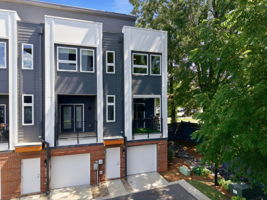 End-Unit Rear Exterior Beneath a Mature Tree Canopy