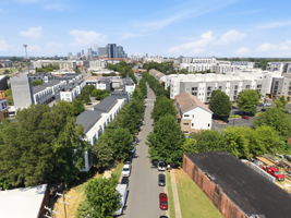 Tree-Lined Community Streetscape with Uptown in the Distance