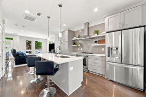 Spacious Kitchen with Stainless Steel Appliances and Island Seating