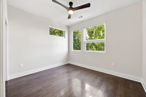 Second Bedroom Suite with Multiple Windows and Private Bathroom