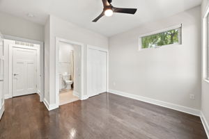 Second Bedroom with Wood Floors, Closet, and Ensuite Bathroom