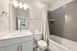 Second Full Bathroom with Tiled Tub and Shower Surround