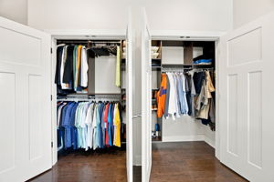 Large Primary Closet with Custom Built-In Storage