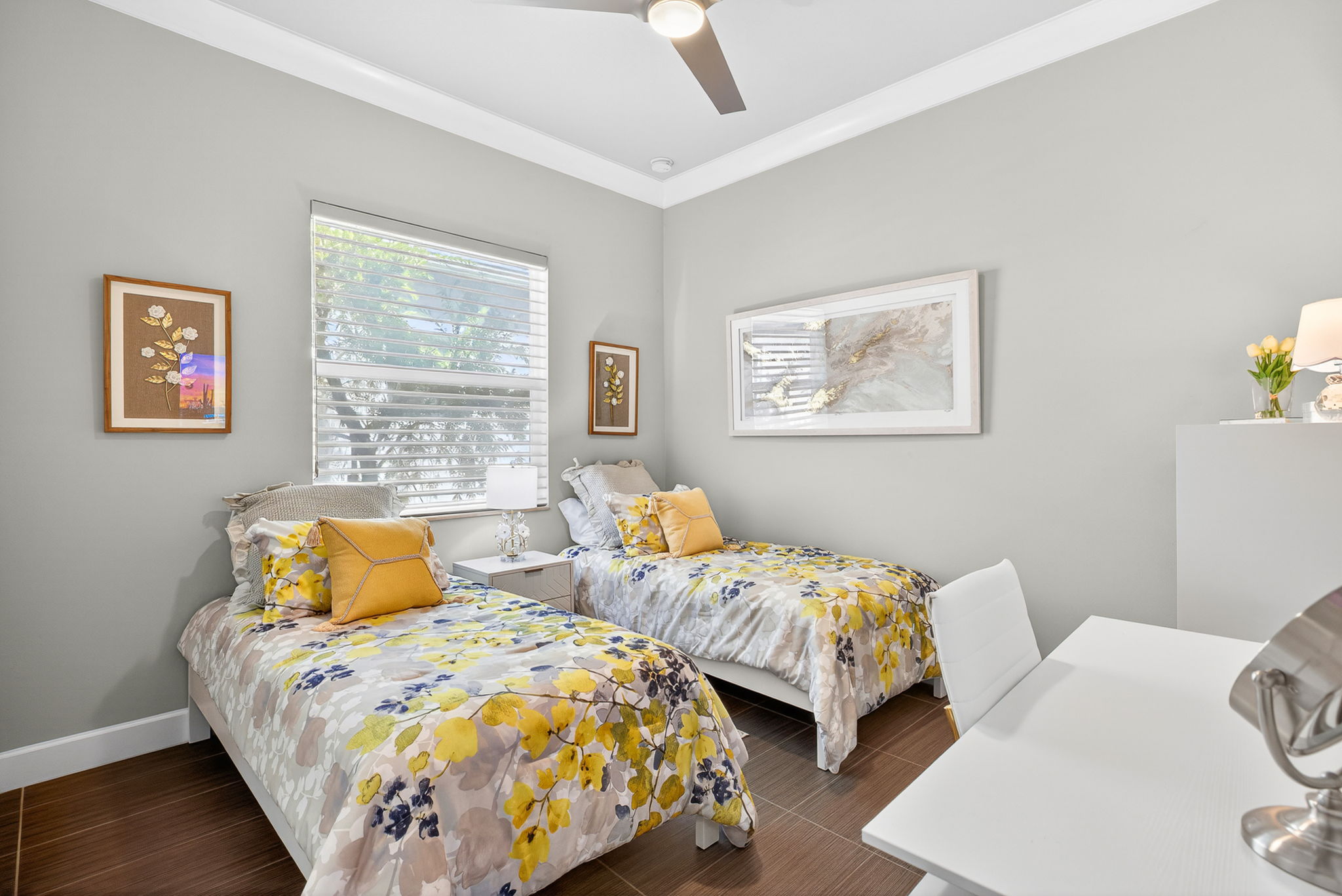 Guest bedroom with crown molding and Hunter Douglas window treatments...