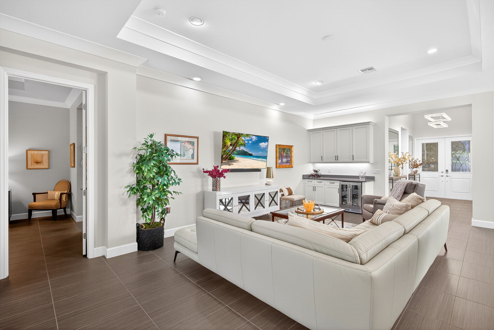 Look how the plank tile flows seamlessly from room to room! Designer paint colors, lots of hi-hat LED lighting, plus 5 ceiling fans are present in this home!