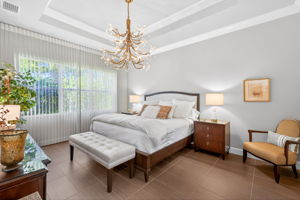 Elegance abounds here with the gold chandelier, soft, designer custom blinds cover the entire wall of windows. Room holds a king bed, 2 nightstands, dresser and a chair!